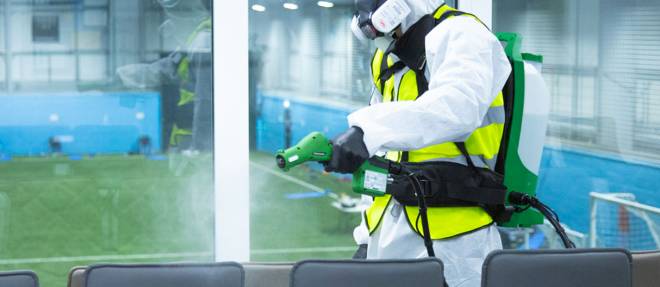 After death cleaning technician carrying out professional fogging treatment in UK property