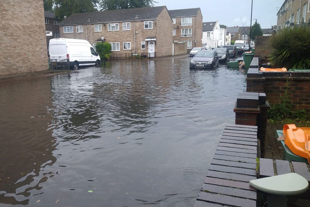 Flooded street after a river burst its bank